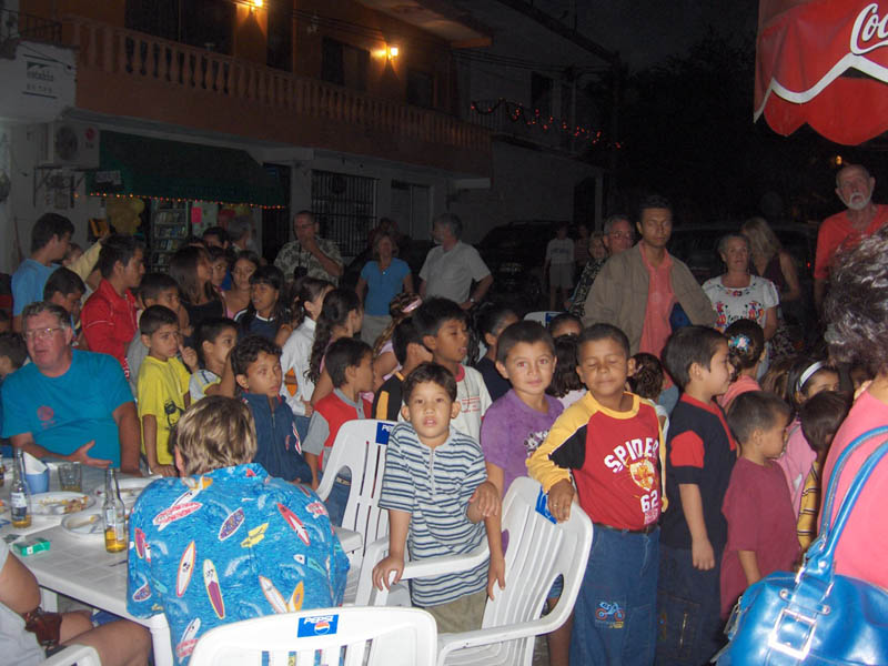 Mexican Ninos lining up for Presents II