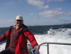 Rae is riding Dive Tutekaka's high speed boat out to the Poor Knights Islands in a rough sea.