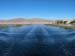 Sailing through the reeds with Puno in the background